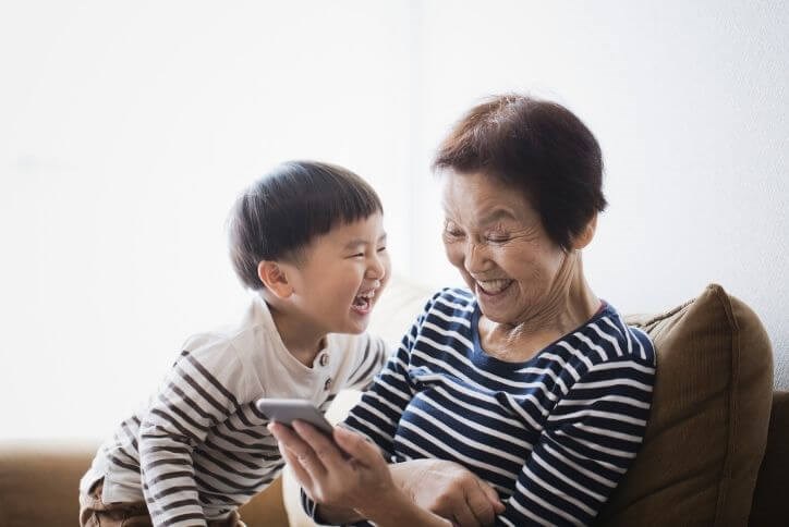 Happy grandma and grandson laughing | Canyon Falls, a new home community in Flower Mound, TX