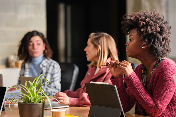 Women talking in meeting Canyon Falls, Tx